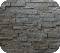 Mur en pierre naturelle avec parement texturé pour finition architecturale.